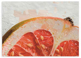 Horizontales Wandbild farbenfroh mit einer Scheibe Zitrusfrucht. Verfügbar auf kudeko.com.