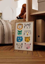 Cuadro con ocho caras de animales felinos en amarillo, azul, verde, rosa, negro y blanco, composición divertida de estilo infantil. Disponible en kudeko.com