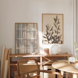 Minimalistisches Wandbild mit Schatten von Zweigen auf neutralem Hintergrund, ideal für eine ruhige und natürliche Dekoration. Erhältlich auf kudeko.com