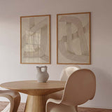 Conjunto de dos cuadros abstractos con líneas beige entrelazadas. kudeko.com