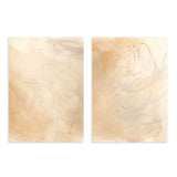 Conjunto de dos cuadros con formas abstractas difusas, líneas suaves, fondo crema y beige, composición ligera en tonos arena, de estilo abstracto. Disponible en kudeko.com