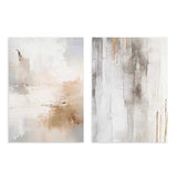 Conjunto de dos cuadros con composición abstracta en blanco, beige, gris cálido y detalles dorados, con texturas suaves, manchas difusas y acabado elegante de estilo abstracto. Disponible en kudeko.com