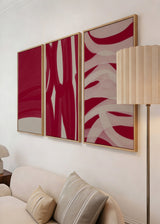 Ensemble de trois tableaux encadrés avec formes abstraites organiques en bordeaux, rouge lie-de-vin et beige, dans un style moderne aux lignes courbes et composition équilibrée. Disponible sur kudeko.com