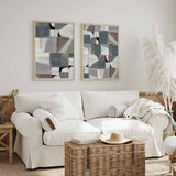 Quadro com composição abstrata de formas geométricas suaves e blocos sobrepostos em cinza azulado, bege, branco pérola, taupe e preto, num estilo abstrato contemporâneo. Disponível em kudeko.com