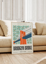 Tableau encadré du pont de Brooklyn avec grandes fleurs vert menthe, structure orange corail, base bleu profond et style illustration rétro urbaine sur fond clair. Disponible sur kudeko.com
