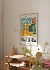 Tableau encadré illustré du Palais de Pena avec tours, coupole et façades en jaune, turquoise, orange et bleu foncé, dans un style architectural graphique et décoratif. Disponible sur kudeko.com