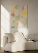 Tableau abstrait encadré avec taches diffuses jaune doux, bleu ciel, vert sauge et rose poudré sur fond clair, style éthéré et contemporain. Disponible sur kudeko.com