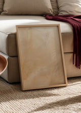 Quadro abstrato emoldurado com linhas finas irregulares sobre fundo bege, creme e areia, num estilo depurado e contemporâneo. Disponível em kudeko.com