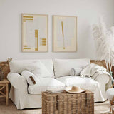 Cuadro con collage abstracto de formas rectangulares en blanco roto, beige claro y detalle mostaza, de estilo minimalista. Disponible en kudeko.com
