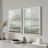 Wandbild mit Seenlandschaft in Graugrün, leichtem Nebel, zarten Bergen, weichem Horizont und natürlichem Landschaftsstil. Erhältlich auf kudeko.com