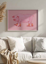 Cuadro ilustración de un cerdo con botas vaqueras rojas sobre fondo rosado, tienda kudeko.com