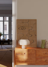 Cuadro decorativo de estilo minimalista y abstracto colocado en salón, rostros abstractos en líneas continuas, modelo Soplo Otoñal II