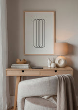 Tableau encadré avec cylindres noirs superposés, lignes fines arrondies sur fond blanc, composition géométrique épurée en style minimaliste noir et blanc. Disponible sur kudeko.com