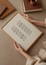 Quadro emoldurado com cubos lineares pretos sobre fundo branco, dispostos em duas colunas simétricas, com profundidade visual limpa e estilo geométrico contemporâneo. Disponível em kudeko.com