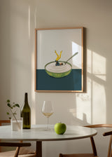 Tableau encadré d’une femme faisant du yoga dans un bol de yaourt blanc, avec récipient vert décoré, cuillère métallique, fond clair et style illustration surréaliste contemporain. Disponible sur kudeko.com