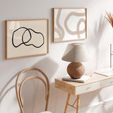 Cuadro horizontal abstracto de ilustración artística con formas en trazo negro y fondo beige.