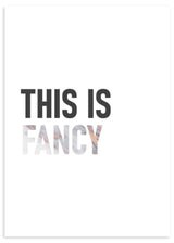 Tableau encadré avec la phrase THIS IS FANCY sur fond blanc, grandes lettres noires, nuances gris, beige et rose poudré, style typographique moderne et épuré. Disponible sur kudeko.com
