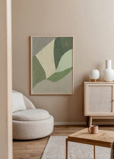 Tableau encadré avec formes géométriques et organiques en vert olive, vert sauge, crème et beige, dans une composition abstraite douce et équilibrée au style contemporain. Disponible sur kudeko.com