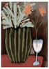Tableau avec vase cannelé vert olive, branches vert clair, petites fleurs roses, deux fleurs orange, verre blanc, fond brun et style floral contemporain. Disponible sur kudeko.com