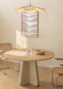 Tableau encadré avec grande feuille stylisée en segments organiques beige rosé sur fond blanc, composition épurée, palette douce et style minimaliste nordique. Disponible sur kudeko.com