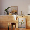 Quadro quadrado fotográfico de um ramo com laranjas frescas em um vaso disponível em kudeko.com