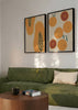 Ensemble de deux tableaux avec oranges entières et en tranches, papayes ouvertes, fond clair, tons orange, crème, noir et vert doux, style illustration décorative contemporaine. Disponible sur kudeko.com