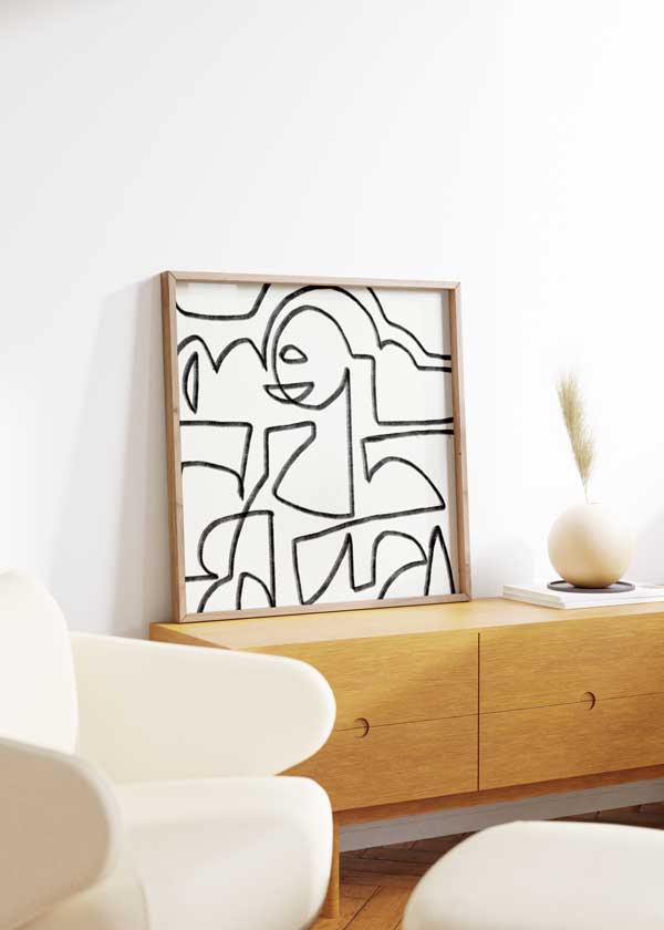 Tableau carré avec composition abstraite de lignes noires épaisses, formes organiques irrégulières, fond blanc et style graphique moderne et minimaliste. Disponible sur kudeko.com