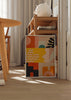 Tableau encadré avec composition abstraite de formes organiques, pois, arches et blocs géométriques en jaune moutarde, terracotta, rose poudré, noir et vert bleuté, dans un style rétro contemporain. Disponible sur kudeko.com