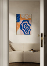 Tableau encadré avec composition abstraite de formes organiques, blocs courbes et lignes ondulées en bleu, orange, rose poudré et blanc cassé, dans un style contemporain. Disponible sur kudeko.com
