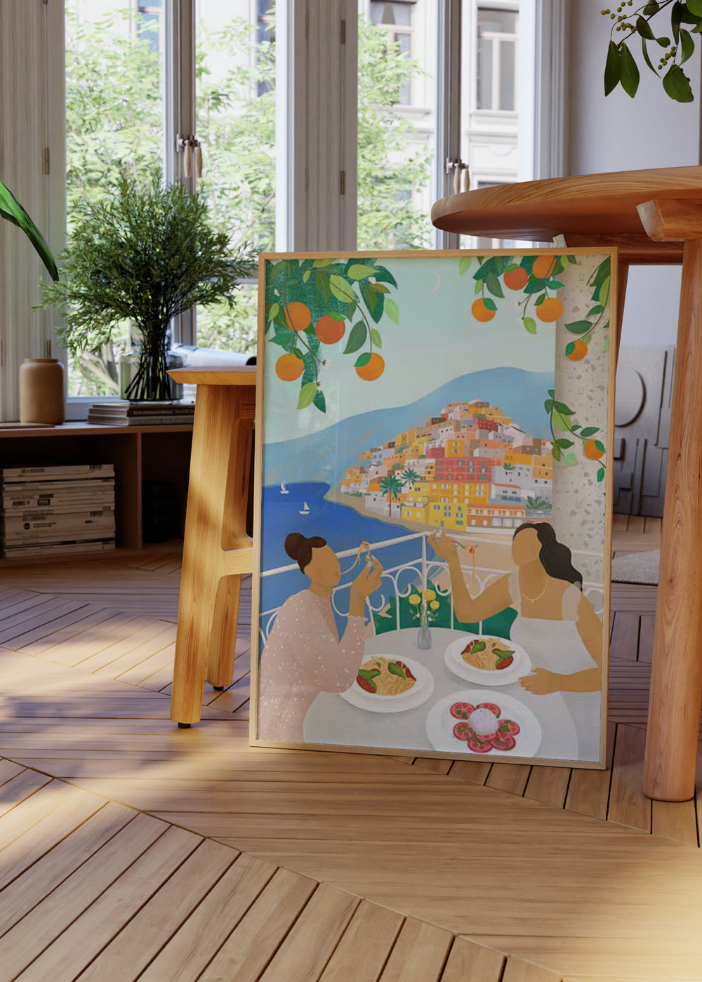 Cuadro decorativo de estilo colorido y ilustración colocado en comedor, ilustración mediterránea de amigas en Positano, modelo Girls in Positano