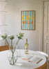 Cuadro decorativo de estilo mar_y_playa y minimalista colocado en cocina, tipografía veraniega inspirada en Italia, modelo Ciao Bella IV