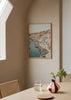 Cuadro decorativo de estilo mar_y_playa y tonos_pastel colocado en salón, vista costera pastel de Procida, modelo Procida Island