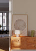 Gerahmtes Wandbild mit großem marmorierten Kreis in Off-White, Beige und Gold, cremefarbenem Hintergrund, olivgrünen geschwungenen Linien, minimalistischem Stil. Erhältlich auf kudeko.com