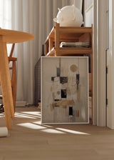 Quadro com composição abstrata de retângulos pretos, linhas cinzentas, círculos dourados e fundo bege claro, num estilo geométrico contemporâneo e equilibrado. Disponível em kudeko.com
