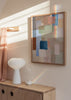Gerahmtes Wandbild mit abstrakter Komposition aus überlagerten Blöcken in tiefem Blau, Salbeigrün, Altrosa, Beige, Creme und Braun, im klaren zeitgenössischen Stil. Erhältlich auf kudeko.com