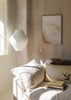 Tableau avec formes ondulées superposées dans des tons crème, beige, sable et terracotta doux, composition fluide au style abstrait et lumineux pour décoration murale. Disponible sur kudeko.com
