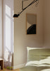 Abstraktes Wandbild mit geschwungenen Formen in Schwarz, Sandbeige, Creme und Taupe, mit umhüllender Komposition, weichen Linien und minimalistischem Stil. Erhältlich auf kudeko.com
