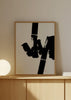 Cuadro decorativo de estilo minimalista y blanco_y_negro colocado en salón, composición abstracta en blanco y negro, modelo Construction