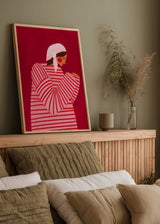 Cuadro decorativo de estilo minimalista y colorido colocado en salón, mujer ilustrada con vestido de rayas rojas, modelo The Woman With the Red Stripes