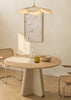 Cuadro decorativo de estilo minimalista y mar_y_playa colocado en salón, conchas sobre arena en tonos suaves, modelo Shells_2