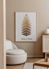 Gerahmtes Wandbild mit braunem und goldenem Farnblatt auf hellem Hintergrund, Schriftzug Merry Christmas, minimalistischer Stil und natürliche weihnachtliche Note. Erhältlich auf kudeko.com