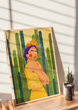 Cuadro de ilustración de Frida Kalho sobre con cactus de fondo. Una de las obras de Raissa Oltmanns