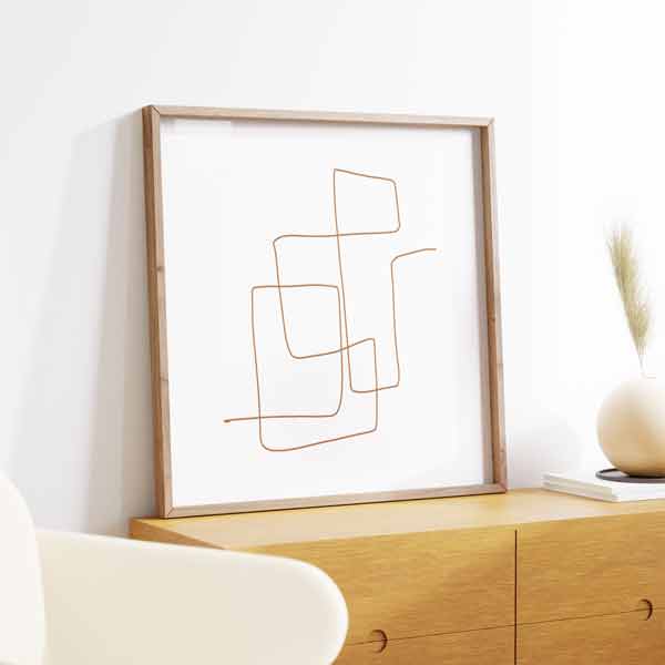 Cuadro cuadrado con líneas finas marrón terracota formando rectángulos irregulares superpuestos sobre fondo blanco, de estilo geométrico. Disponible en kudeko.com