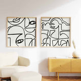 Conjunto de dos cuadros cuadrados abstractos con rostros lineales en blanco y negro, tienda kudeko.com