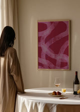 Cuadro abstracto rosa y fucsia con trazos curvos, en marco negro, kudeko.com
