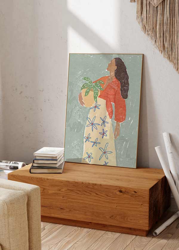 decoración con cuadros, ideas - Cuadro de ilustración de mujer con maceta. Una obra en tonos azules, rojos y crema.