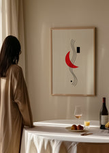 Cuadro decorativo de estilo minimalista y blanco_y_negro colocado en salón, composición abstracta geométrica en rojo y negro, modelo Cubismo Sonoro