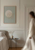 Tableau encadré avec branche de corail marin beige, fond bleu gris, grand cercle blanc et style minimaliste épuré pour une décoration murale apaisante. Disponible sur kudeko.com