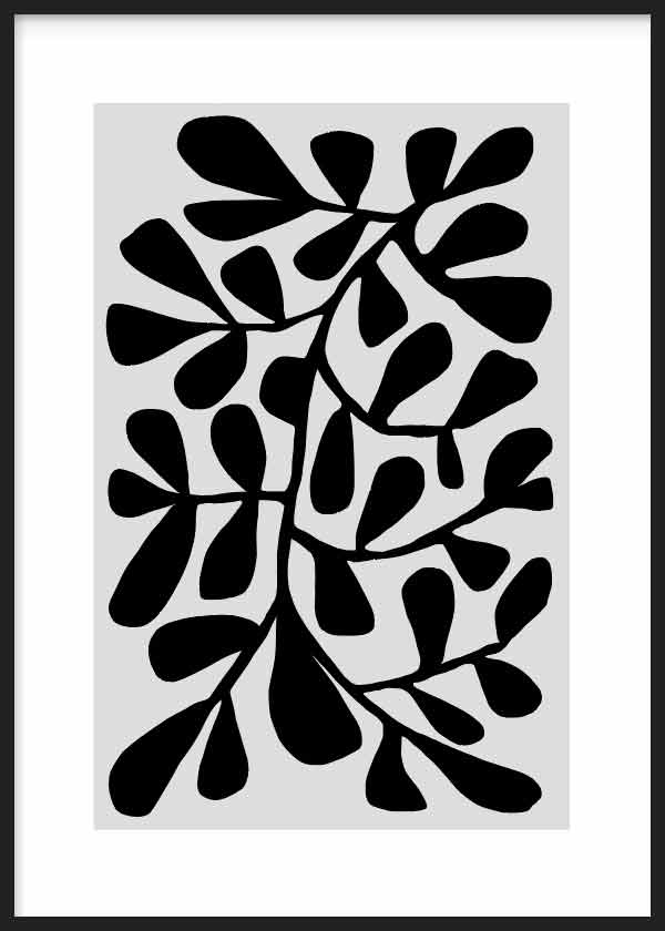 Tableau encadré avec branches et feuilles noires aux formes organiques sur fond blanc, composition botanique contrastée au style abstrait, lignes nettes et palette noir et blanc. Disponible sur kudeko.com